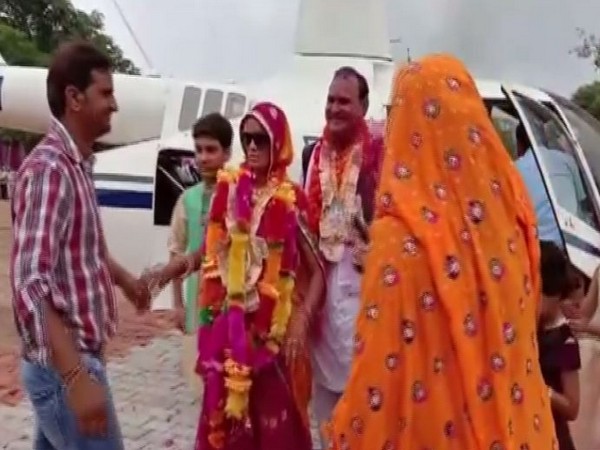 A school teacher, Ramesh Chand Meena has booked a helicopter to return to his home on retirement day in Alwar, Rajasthan. (Photo/ANI)