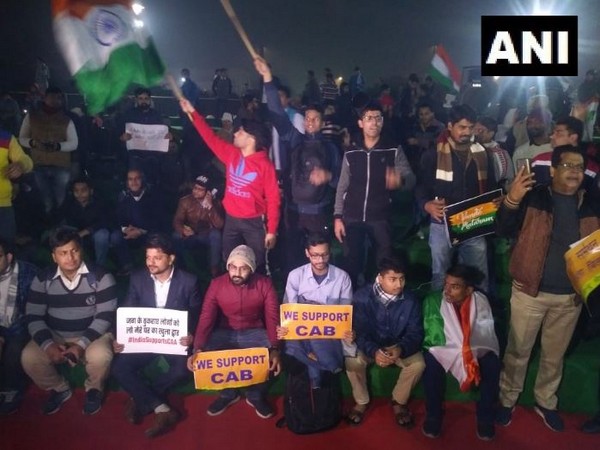 People while staging demonstration in Central Park, Connaught Place on Friday (Photo/ANI)