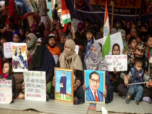 Women sit on dharna in Delhi's Seelampur on Friday. Photo/ANI
