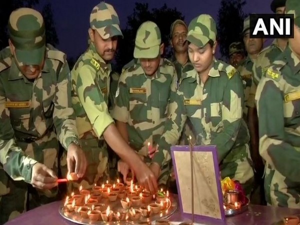 BSF personnel lit earthen lamps on the eve of Diwali in Samba on Saturday (Photo/ANI)