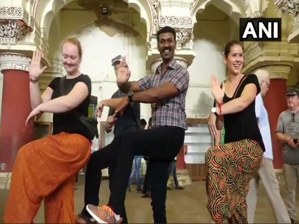 Nagendra Prabhu, tourist guide explains the aspects of Tamil culture to tourists through Bharatanatyam dance form. Photo/ANI