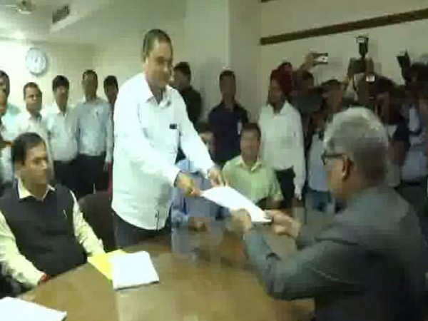 BJP's Kamakhya Tasa handing over his Rajya Sabha nomination papers to the Returning Officer in Guwahati, Assam on Tuesday. (Photo/ANI)