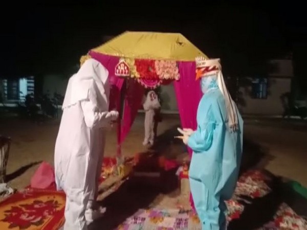 COuple tied the knot wearing PPE kits in Rajasthan's Bara (Photo/ANI)