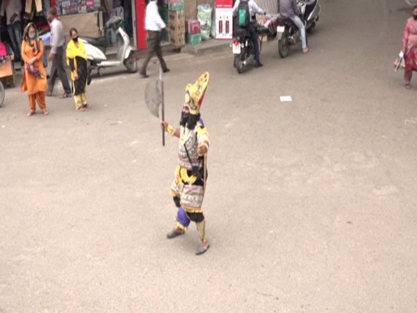 A local artist dressed up as Yamraj in Udhampur (Photo/ANI)