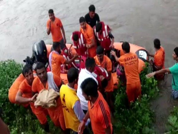 SDRF team rescued locals who were stranded in the flood-affected areas in Pratapgarh, Rajasthan. (Photo/ANI)