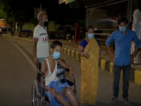 Rani Devi along with her family members outside Delhi's AIIMS Hospital (Photo/ANI)
