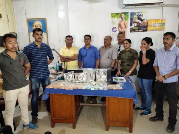 Dibrugarh Police seize a large amount of cash and drugs from a house in Kalibari. (Photo/ANI)
