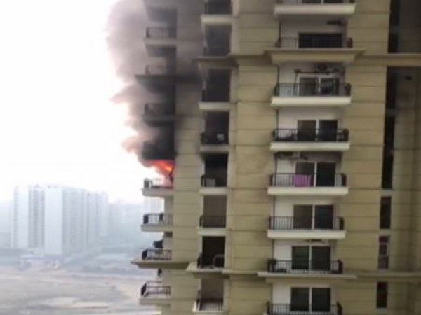 A massive fire broke out in an apartment in Apex Athena society in sector 75 on Friday (Photo/ANI)