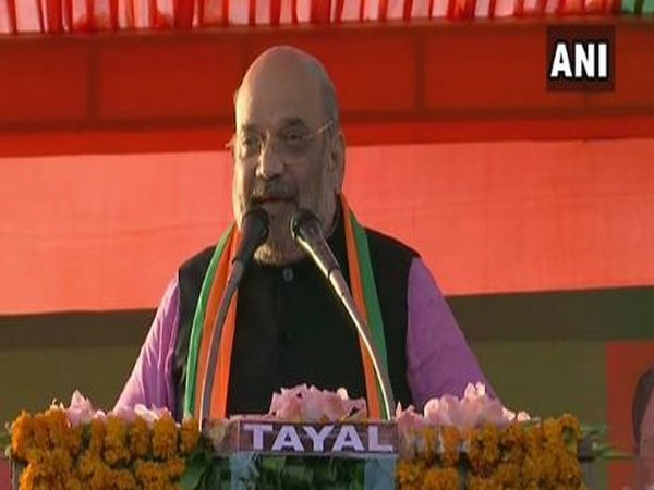 Home Minister Amit Shah while addressing a public rally at Chhatarpur in New Delhi on Thursday. Photo/ANI