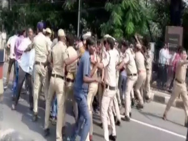 Police personnel trying to control and disperse crowd (Photo/ANI)