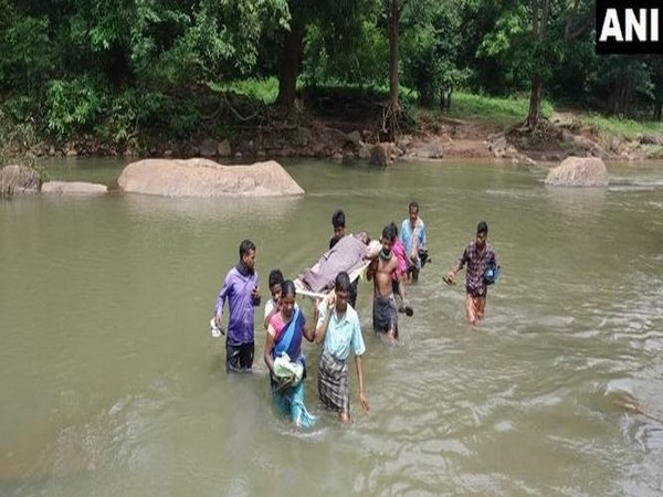 Villagers carried a pregnant woman on a sling for 12 kilometers due to lack of proper road connectivity in Kalahandi district. (Photo/ANI)
