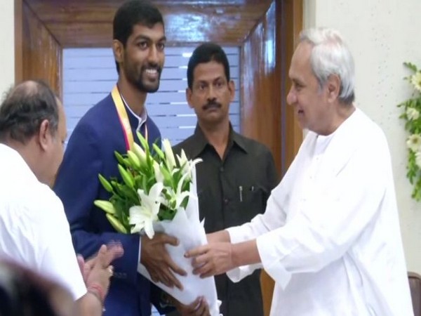 CM Naveen Patnaik felicitated gold medalist Aswatha Narayana on Saturday. (Photo/ANI)