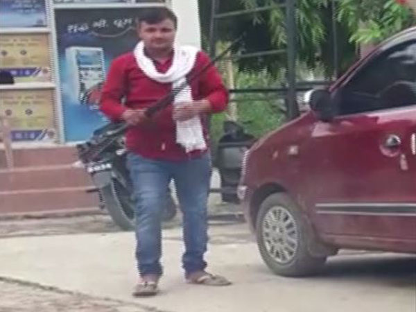 Man fired shots near the petrol pump in Prayagraj [Photo/ANI]