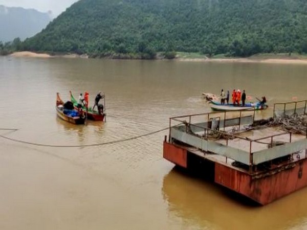 he boat ‘Royal Vasishta’ which capsized in Godavari River last month, was extracted from the river (Photo/ANI)
