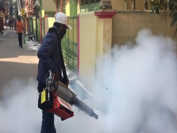 A man disinfecting streets in Siliguri.