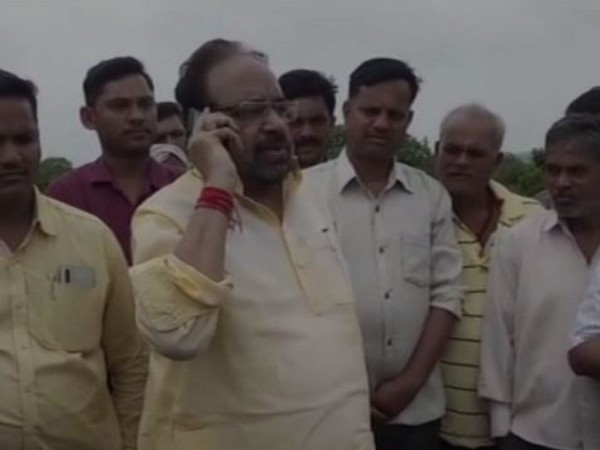 BJP leader Gopal Bhargava talking to the officials on Monday. Photo/ANI