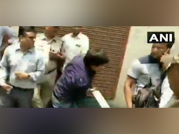 Akash Vijayvargiya trashing a Municipal Corporation officer with a bat in Indore on Wednesday. Photo/ANI