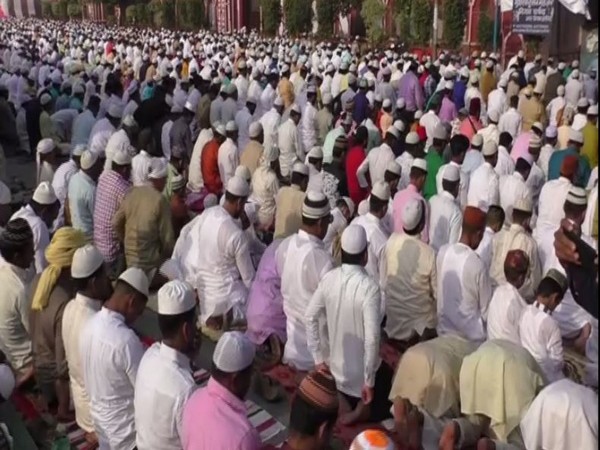 People in Aligarh offer Eid Al Fitr prayers t Shah Jamal Eidgah on Wednesday [Photo/ANI]