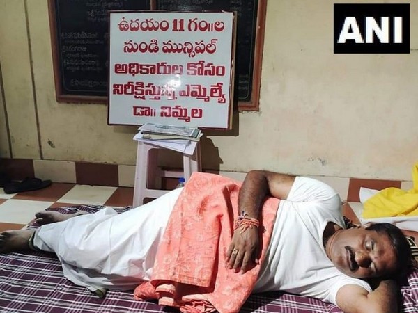 TDP MLA Nimmala Rama Naidu slept outside Municipal Commissioner's Office in Palakollu town. (Photo/ANI)