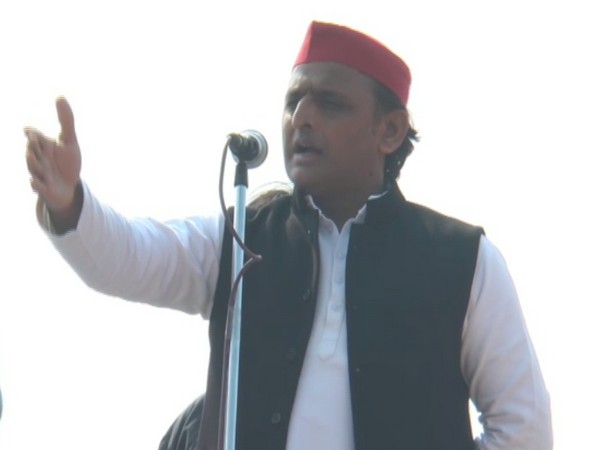 Samajwadi Party chief Akhilesh Yadav addressing a gathering at Republic Day event in Saifai, Uttar Pradesh on Sunday. (Photo/ANI)