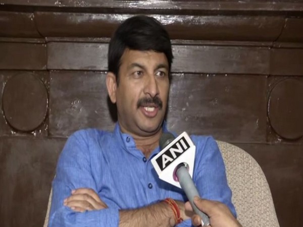 Delhi BJP chief Manoj Tiwari speaking to ANI in Texas on Sunday. Photo/ANI