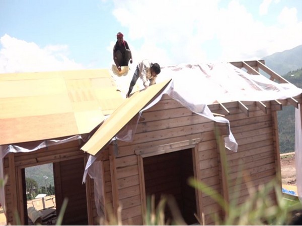 Labourers constructing a hut in Panchari for the tourist. [Photo/ANI]