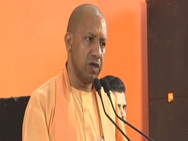 Chief Minister Yogi Adityanath addressing the public in Varanasi on Thursday. Photo/ANI