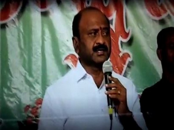TRS MLA Dharma Reddy addressing the meeting