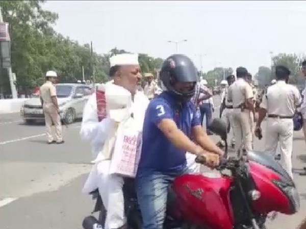 Congress MLA Abidur Rehman was fined for not wearing a helmet while riding on the pillion seat of a motorcycle. (Photo/ANI)