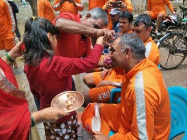 Women and girls tied Rakhis on the wrists of NDRF personnel in Maharashtra's flood-affected district Sangli. (Photo/ANI)