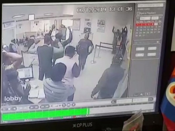 A grab from CCTV recording of the robbery taking place in Basti, UP on Friday.