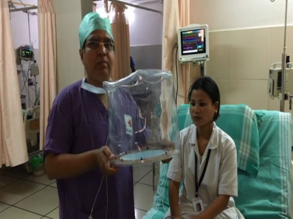 Dr Ganapathi, medical director of Mangala Hospital, Mangaluru, with a 'bubble helmet.' Photo/ANI
