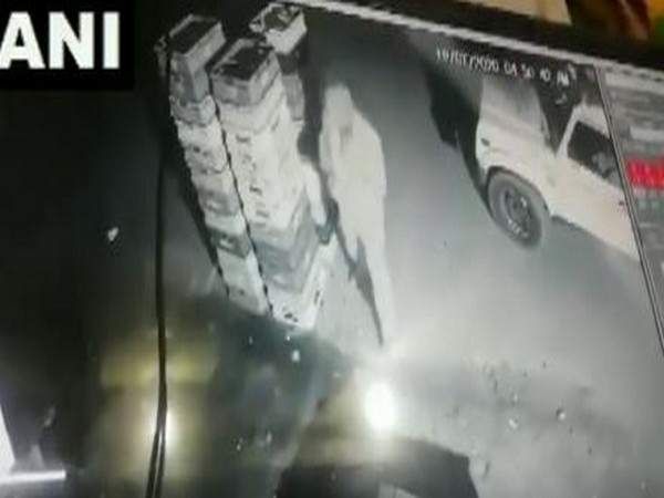 Policeman stole milk packets in Noida on Monday (Photo/CCTV Footage)