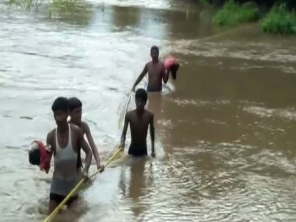 Locals along with municipality authorities rescued four families and a police personnel from Mungeli. (Photo/ANI)