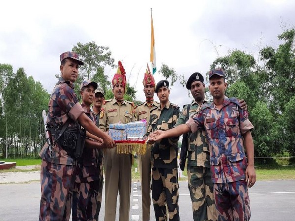 BSF troops exchanged sweets with Border Guards Bangladesh (BGB) at Indo-Bangladesh border at BOP Fulbari, Siliguri (Photo/ANI)