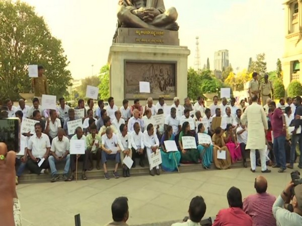 Congress staged protest in front of Mahatma Gandhi's statue at Vidhana Soudha in Bengaluru on Wednesday (Photo/ANI)