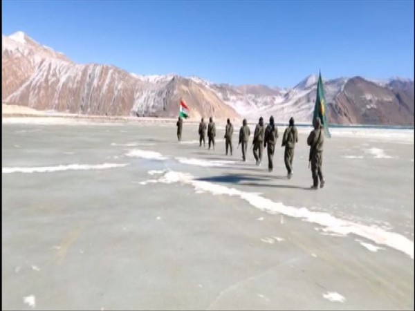 ITBP jawans walking on a frozen water body in Ladakh on Republic Day.