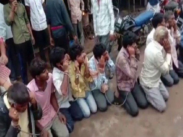 Villagers chained the cow smugglers. Photo/ANI