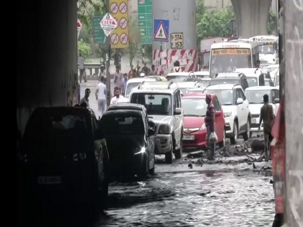 Commuters faced traffic snarls due to water logging in Tughlakabad-Prahladpur area, Delhi on Thursday (Photo/ANI)