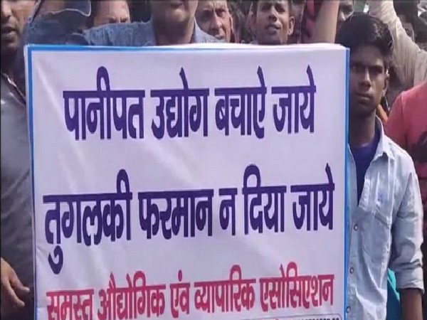 A protest was held in Panipat against closure of industries for the last 17 days in the city. Photo/ANI