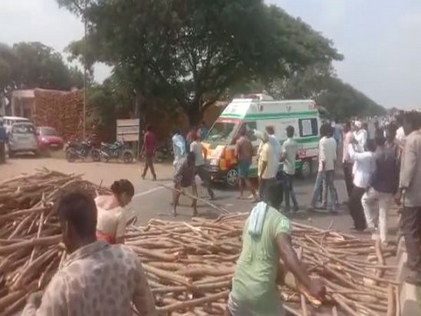 Farmers today blocked the highway by dumping their produce on the road (Photo/ANI)