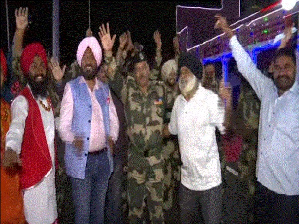 BSF personnel celebrating Diwali with locals at international border in RS Pura. (Photos/ANI)