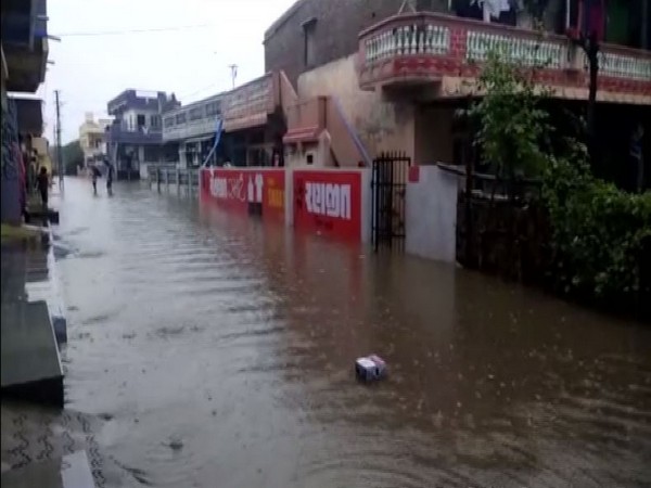 Heavy downpour led to severe water logging in several parts across several parts in Anand district, Gujarat (Photo/ANI)