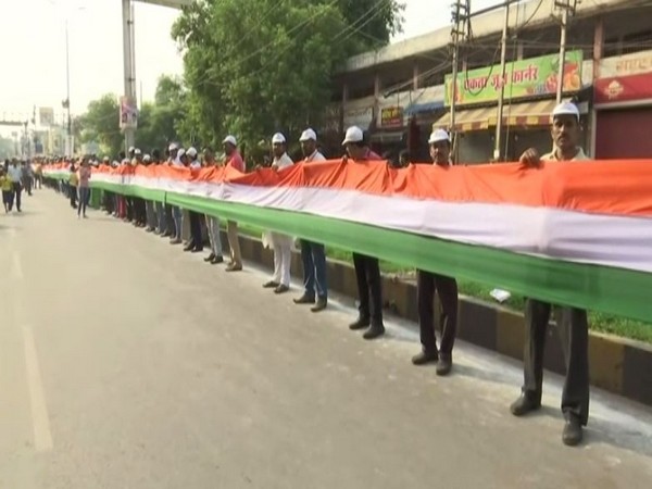Locals conducted 15-km tricolour flag rally formed by human chain in Raipur on Sunday. (Photo/ANI)