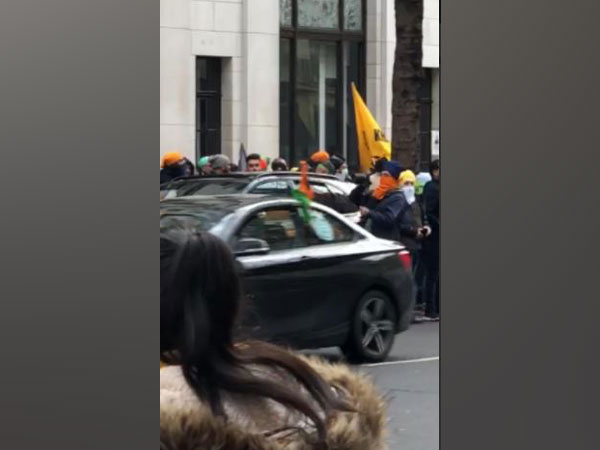 Demonstrators gather near Indian High Commission on Sunday.