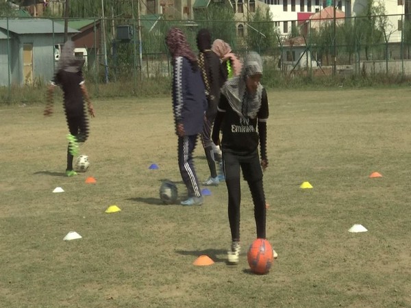 Girls in Kashmir Valley are getting training that will help them make it big in the world of Football. (Photos/ANI)