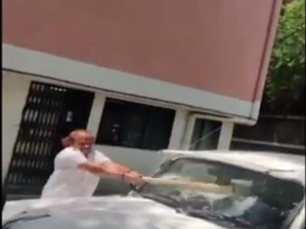 Maharashtra Navnirman Sena (MNS) Corporator Vasant More damages car of an official on Monday. Photo/ANI