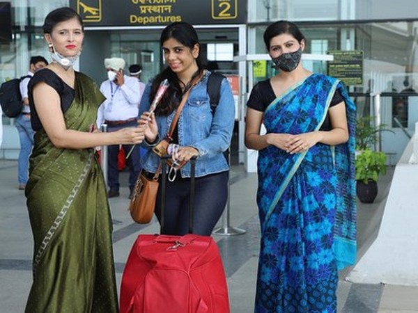 Chandigarh University students and faculty welcoming tourists at Chandigarh International Airport on the eve of World Tourism Day