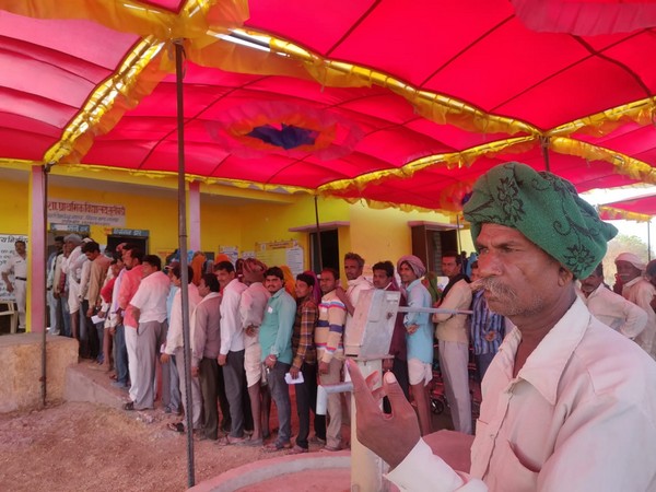 Tribals and villagers queued outside polling booth in Dhar district of Chhattisgarh