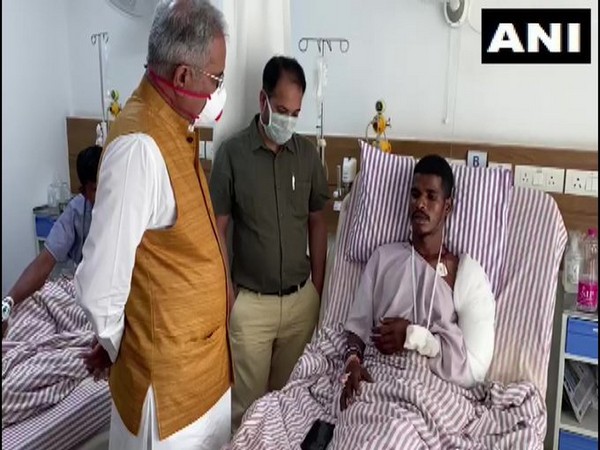 Chhattisgarh CM interacting with one of the jawans who were injured in the encounter with Naxals. Photo/ANI